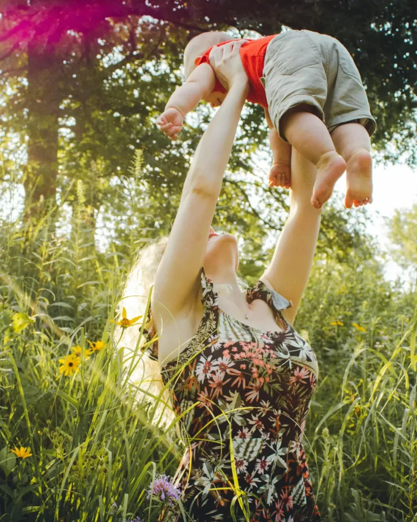 Mother Lifting Her Baby