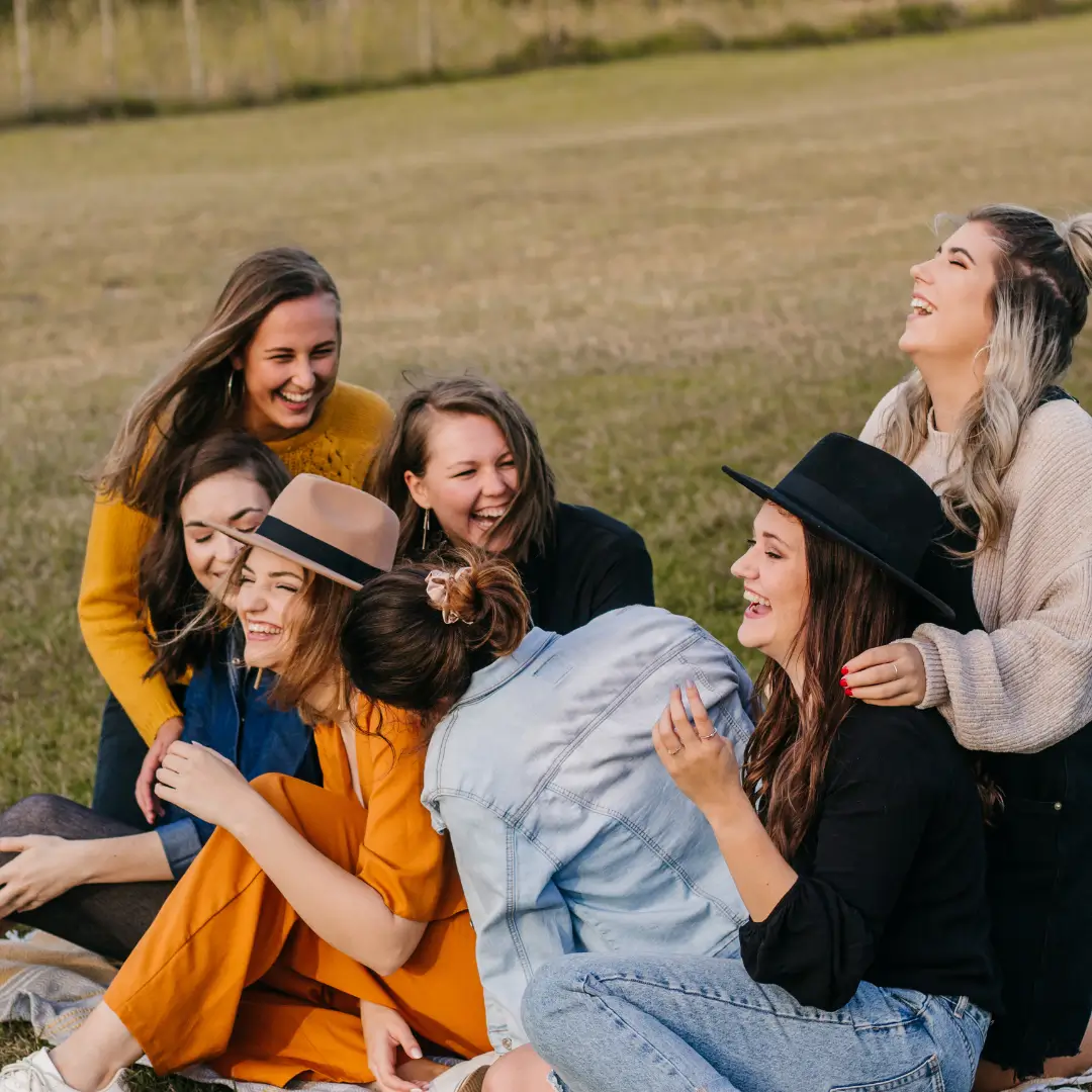 Laughing friends having fun on picnic