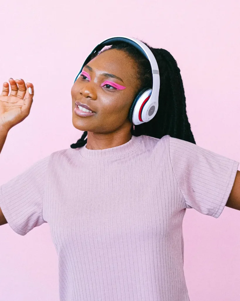A Woman Dancing while Wearing Headphones