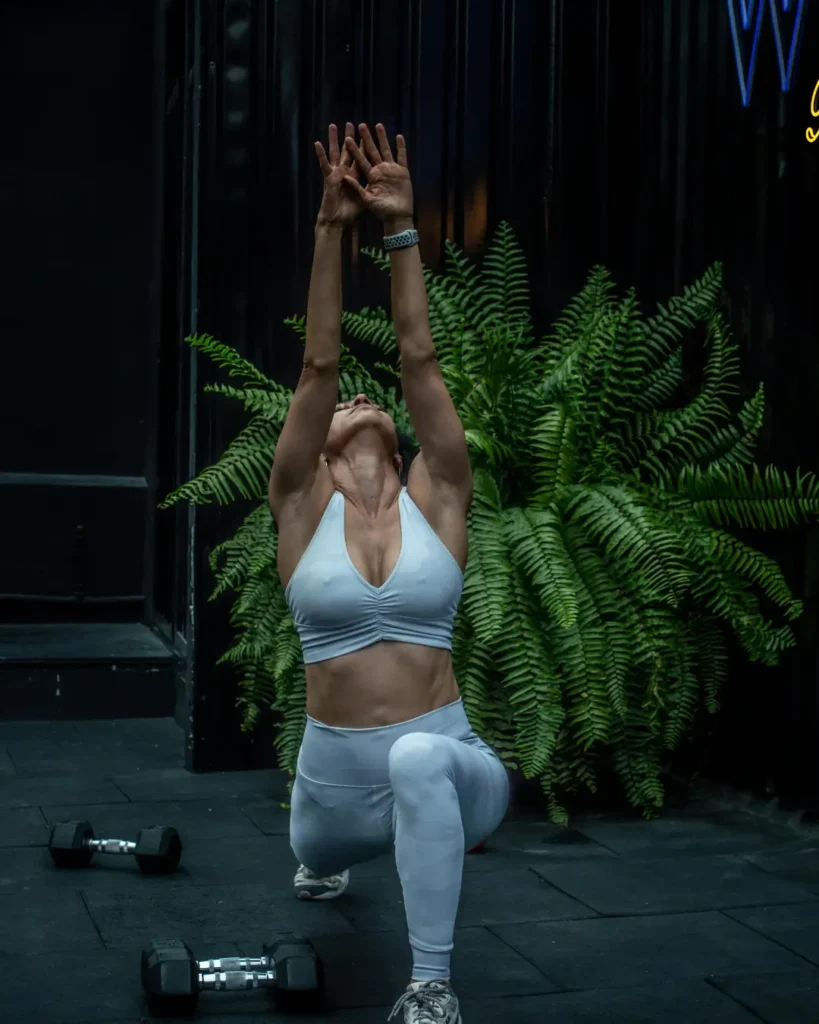 A Woman in White Activewear Working Out
