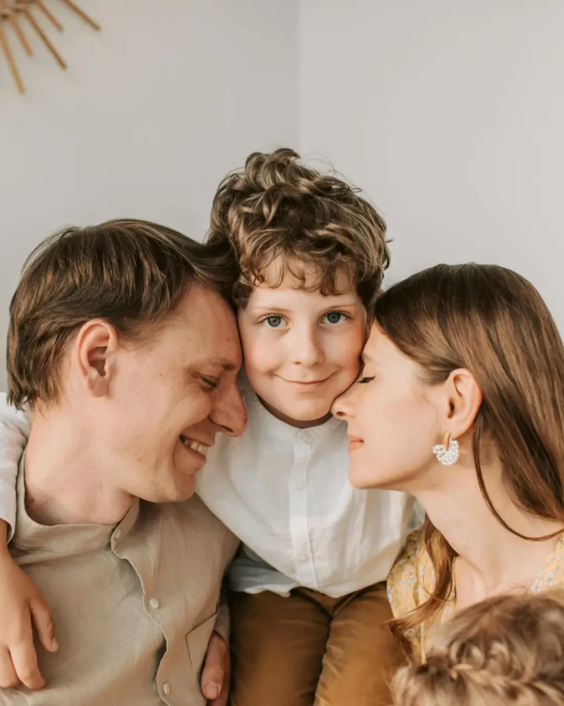 A Boy Hugging His Parents