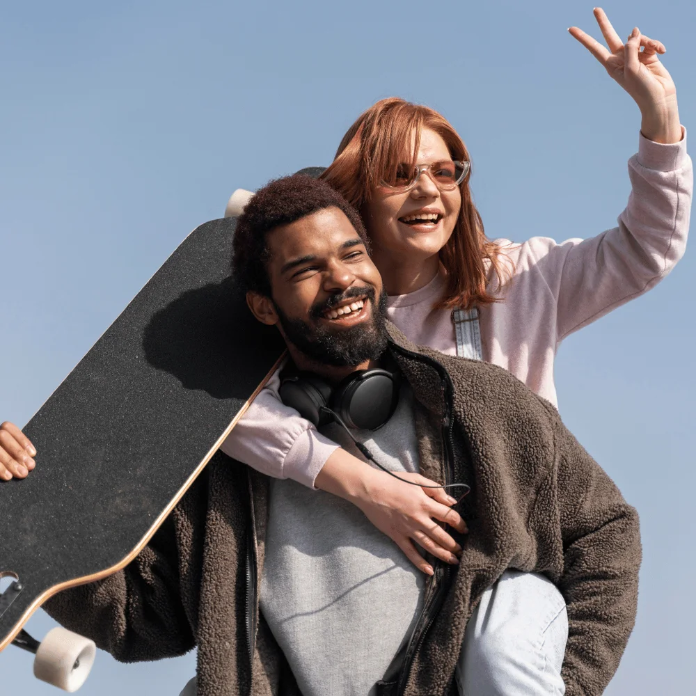 Happy+couple+holding+a+skateboard.+Journal+Prompts+For+Couples