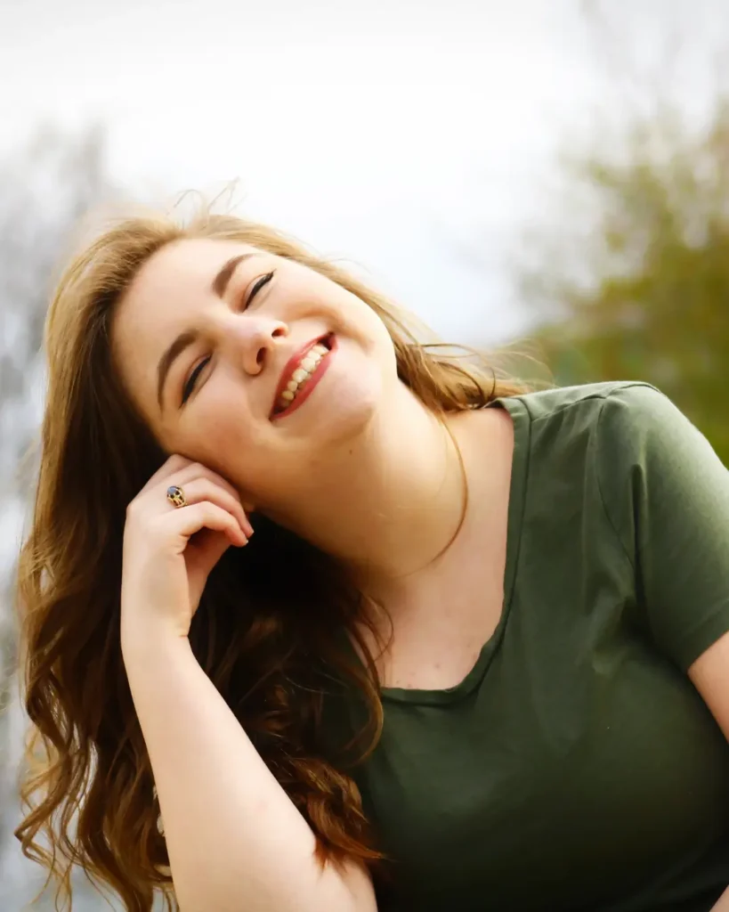 Woman in Green Shirt Smiling