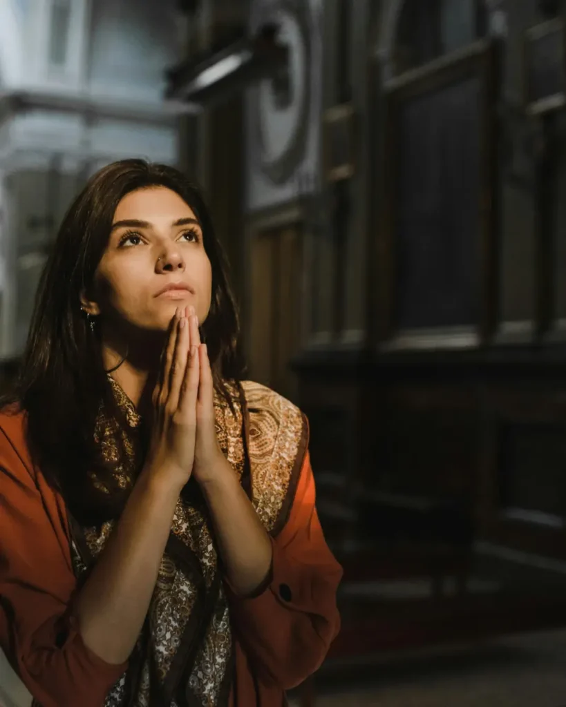 A Woman Praying Inside the Church