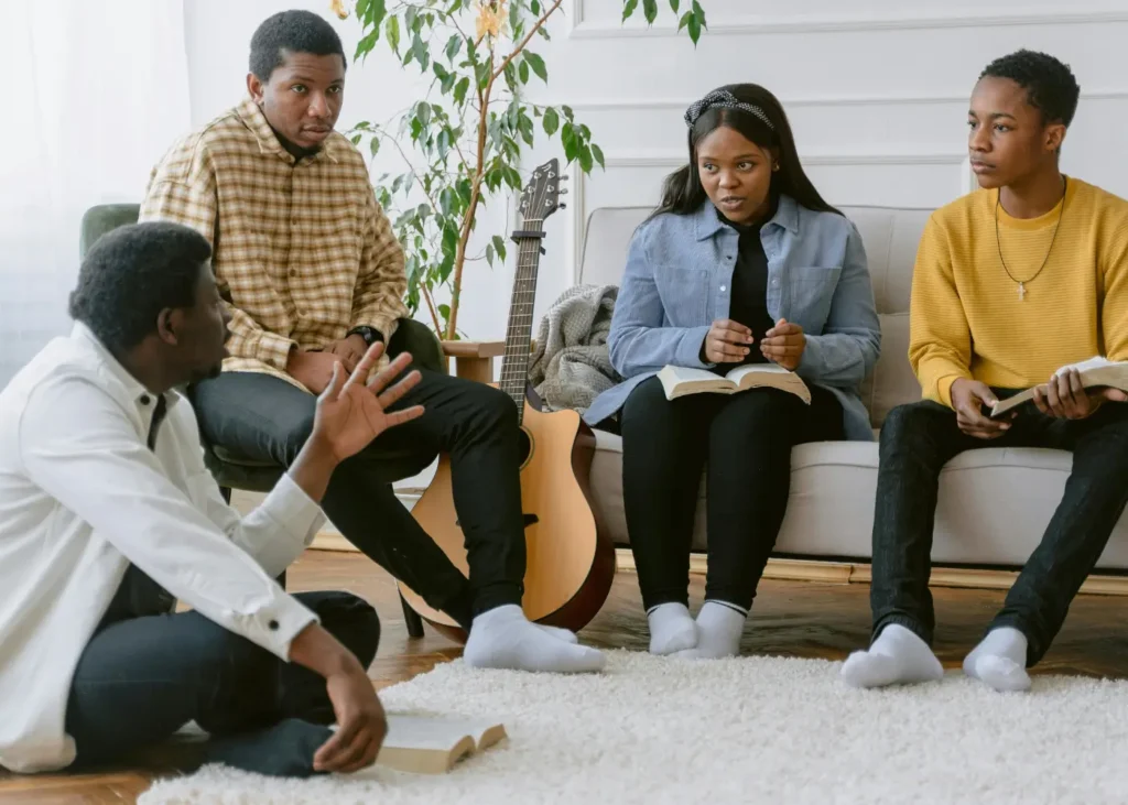 Man and Woman Sitting on White Couch