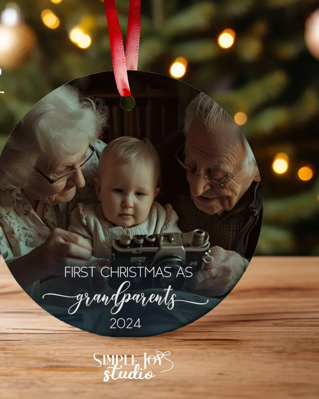 Personalized First Christmas as Grandparents Photo Ornament, with a red ribbon. 