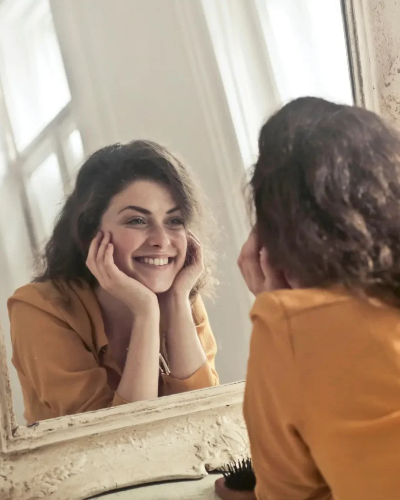 Photo of Woman Looking at the Mirror