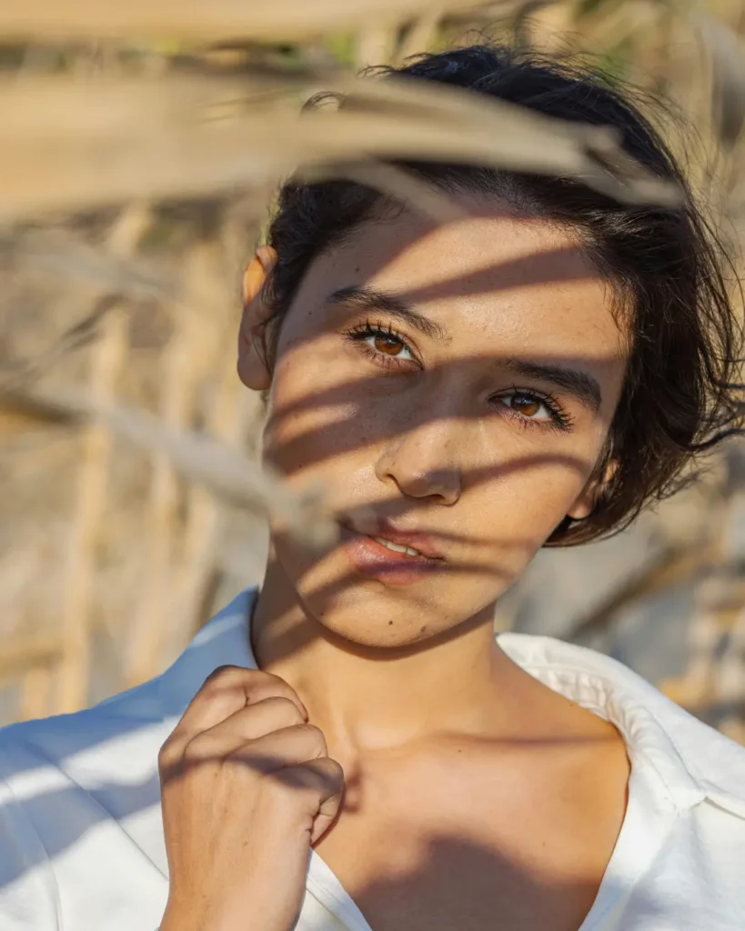 Young Woman in Nature with Playful Shadows
