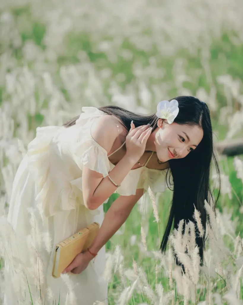 Young Woman in White Dress Enjoying Nature