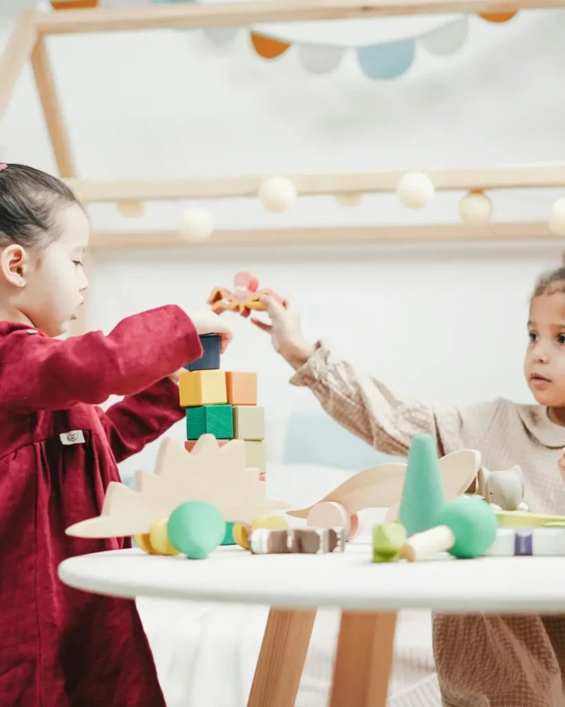 Girl In Red Dress Playing A wooden Blocks