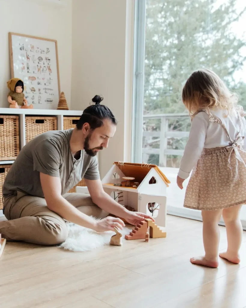 Photo Of Man Playing With Child