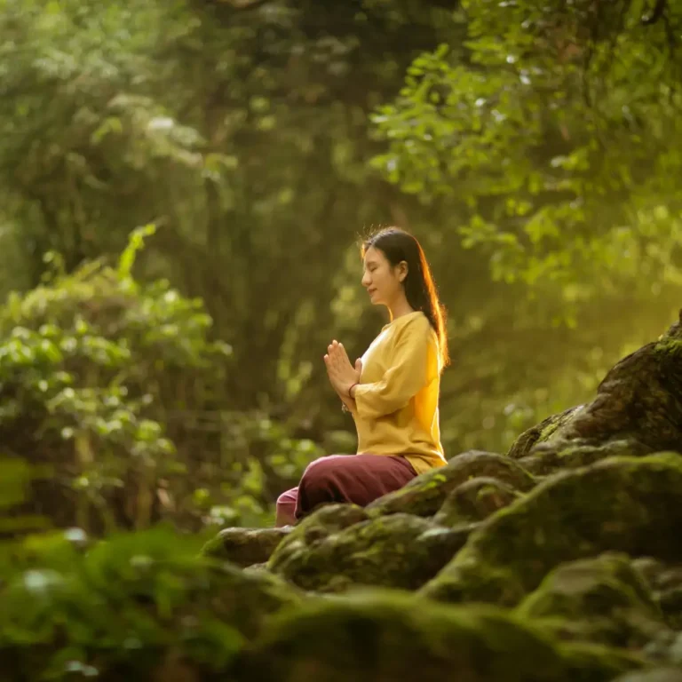 Woman Meditating in a Forest