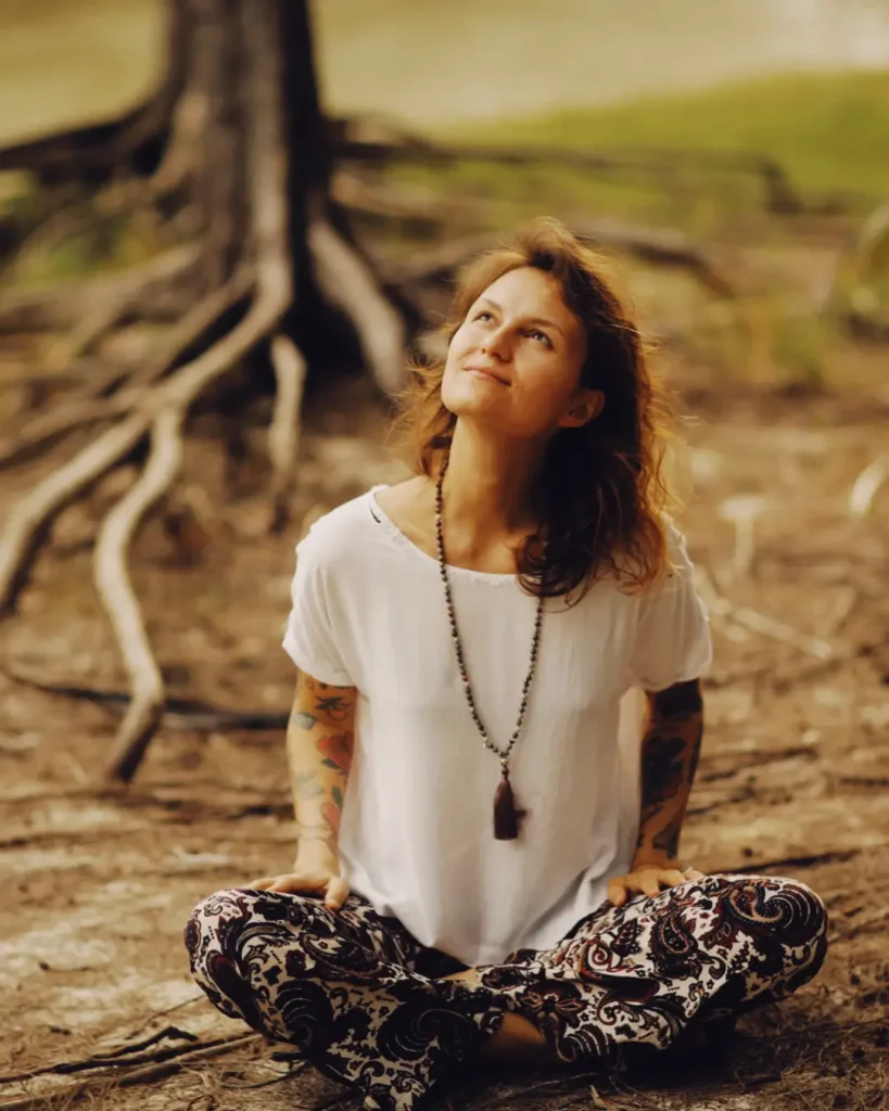 Woman Sitting on the Ground While Looking Up
