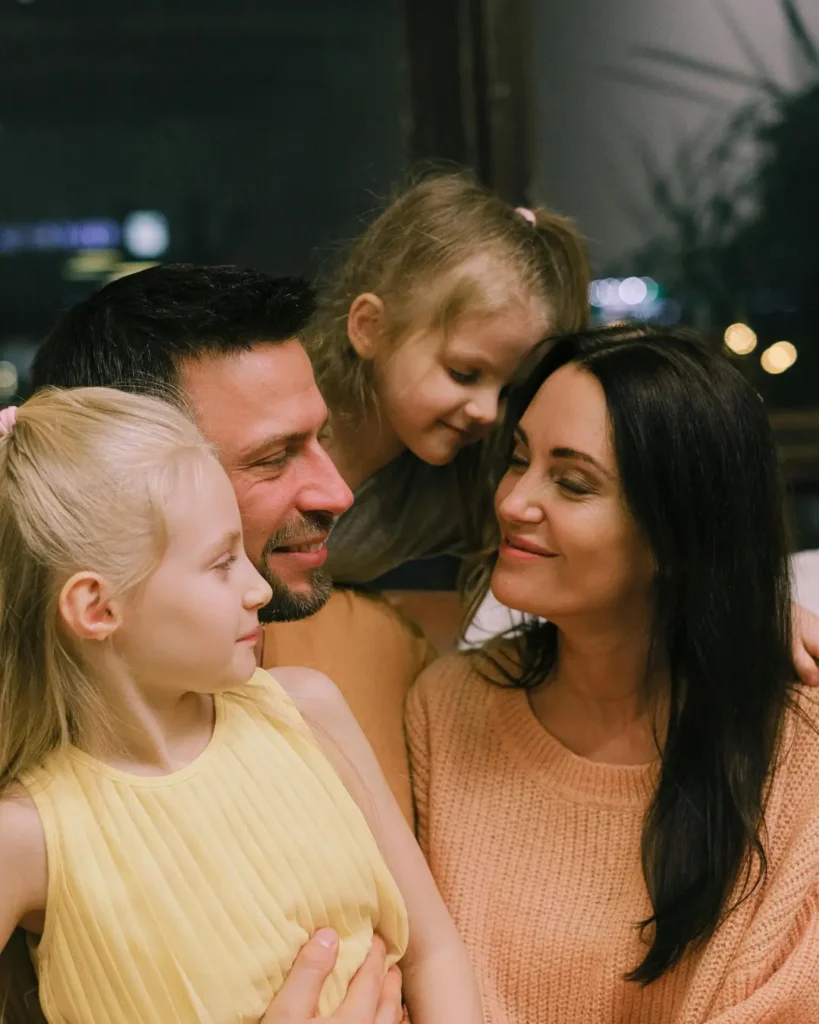 A Happy Family Hugging Each Other