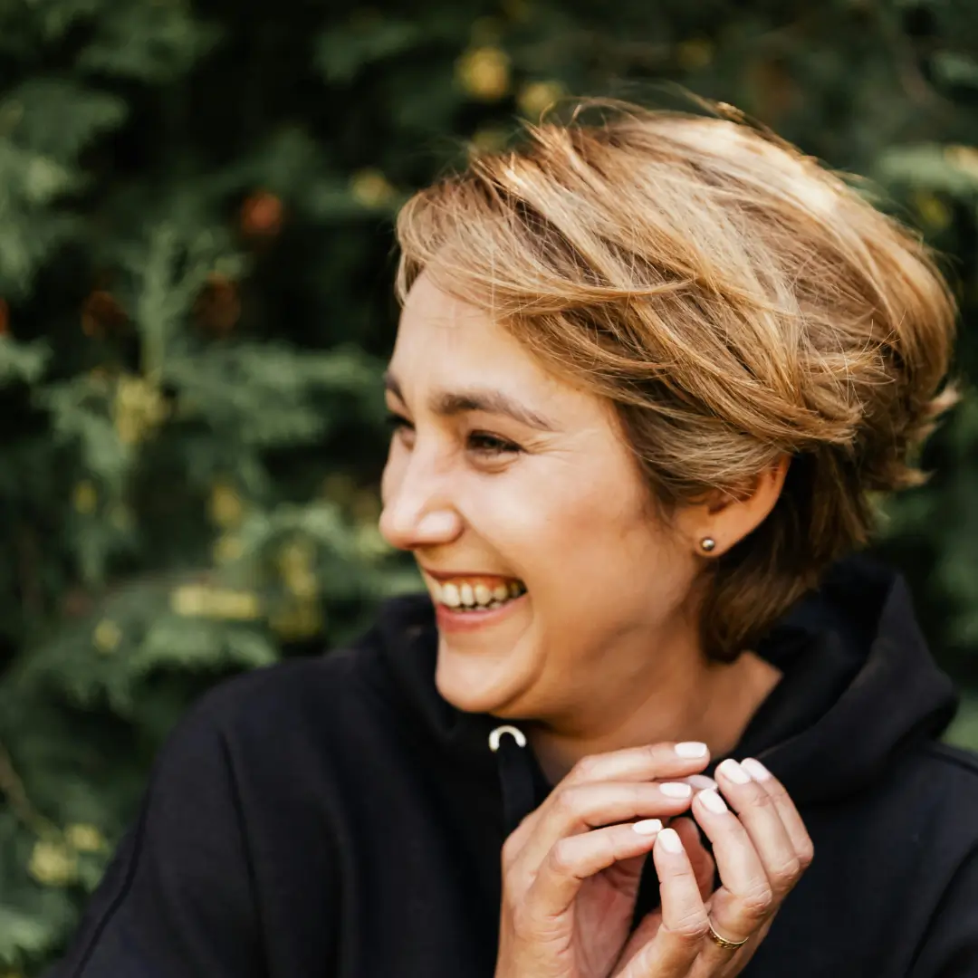 A Woman with a Short Hair Smiling