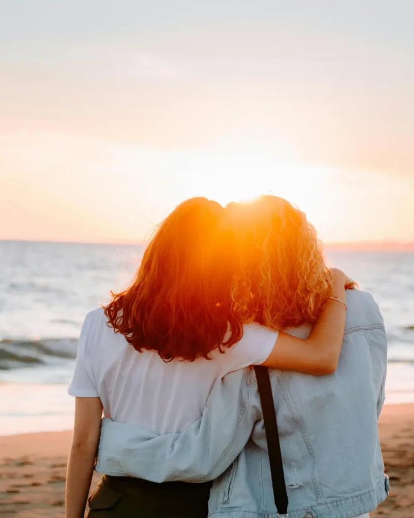 Woman Hugging Looking out at the sea