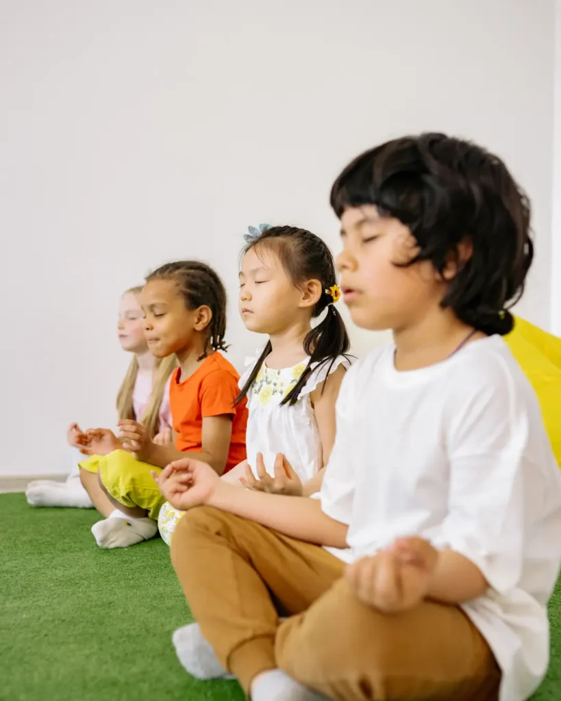 Children In Yoga Position Learning To Concentrate