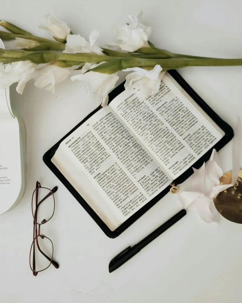 Top View of the Holy Bible, Flowers and a Calendar