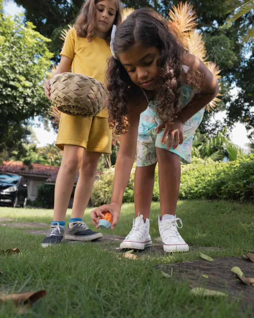 Two Girls Easter Egg Hunting in the Garden
