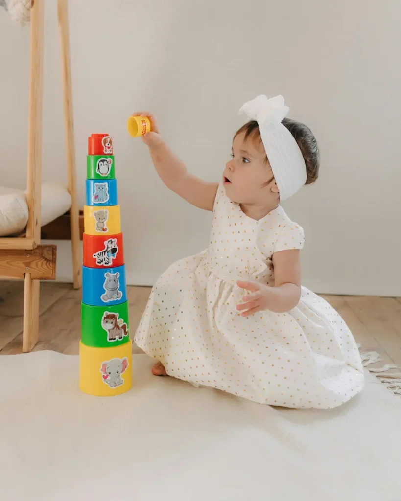 Adorable Baby Playing with Stacking Toys Indoors
