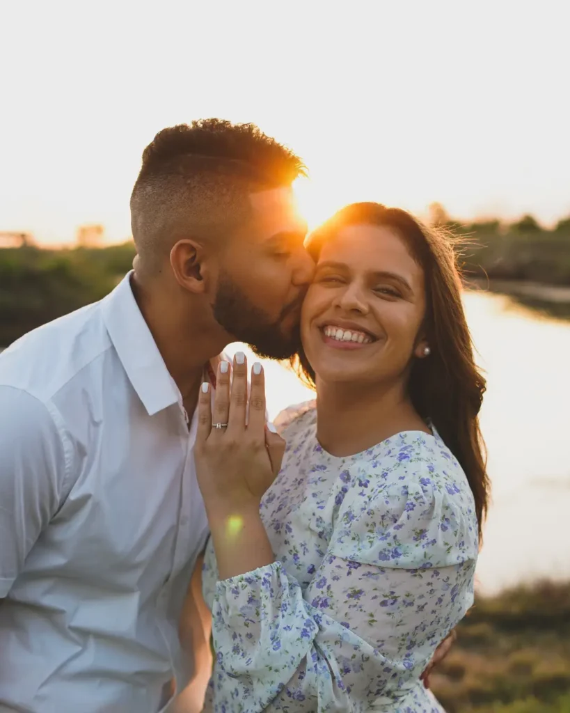 Couple smiling by the water