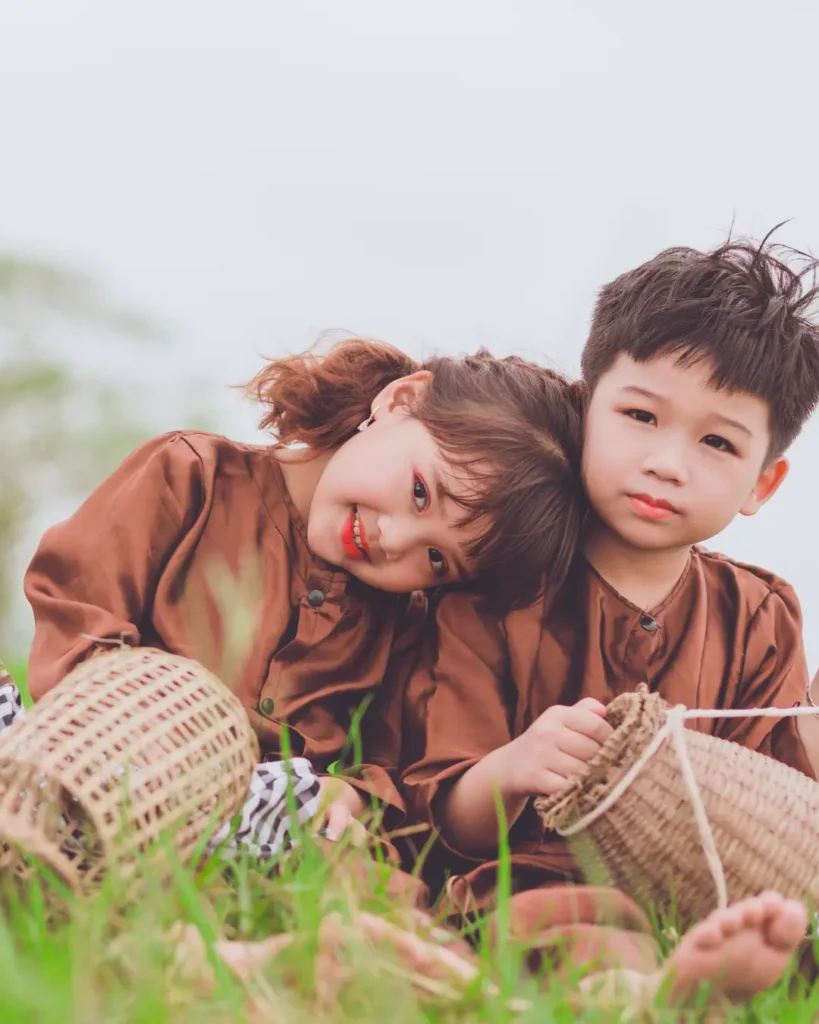 Girl leaning on a boy wearing brown tops