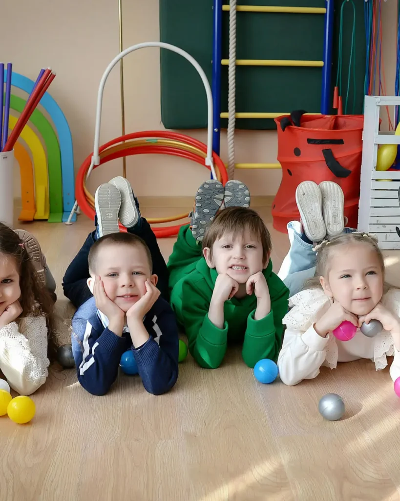 Group of Happy Kids Playing in Indoor Playroom