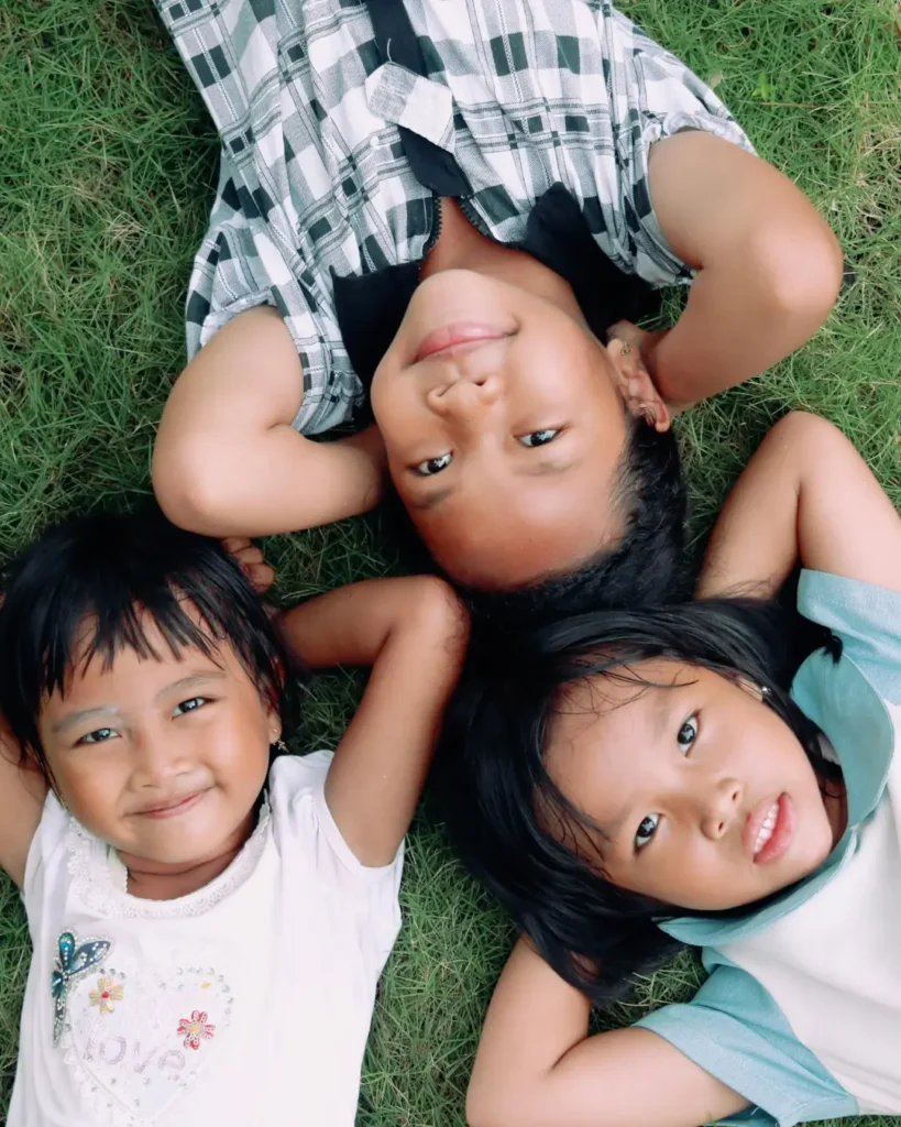 Kids Lying on Grass