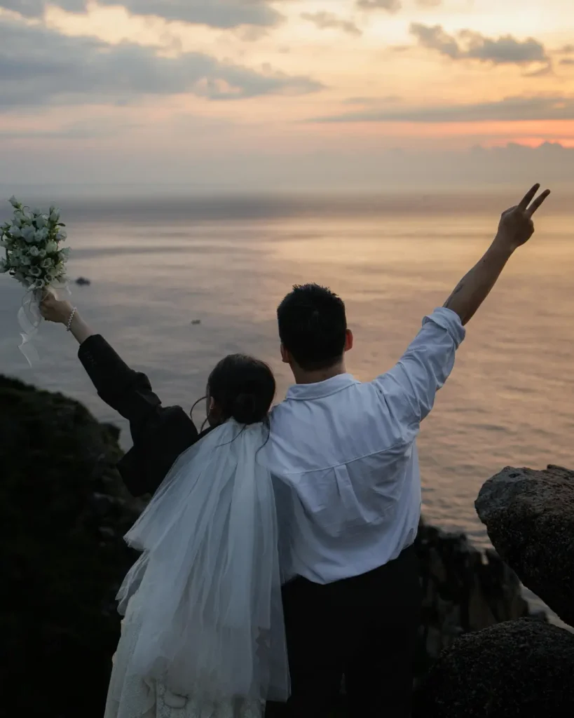 Romantic Wedding Photo at Sunset Overlooking Ocean
