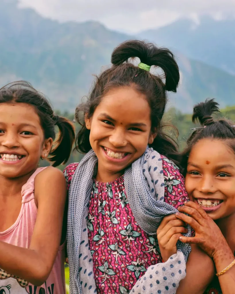 Smiling Children in the Scenic Mountains of Nepal