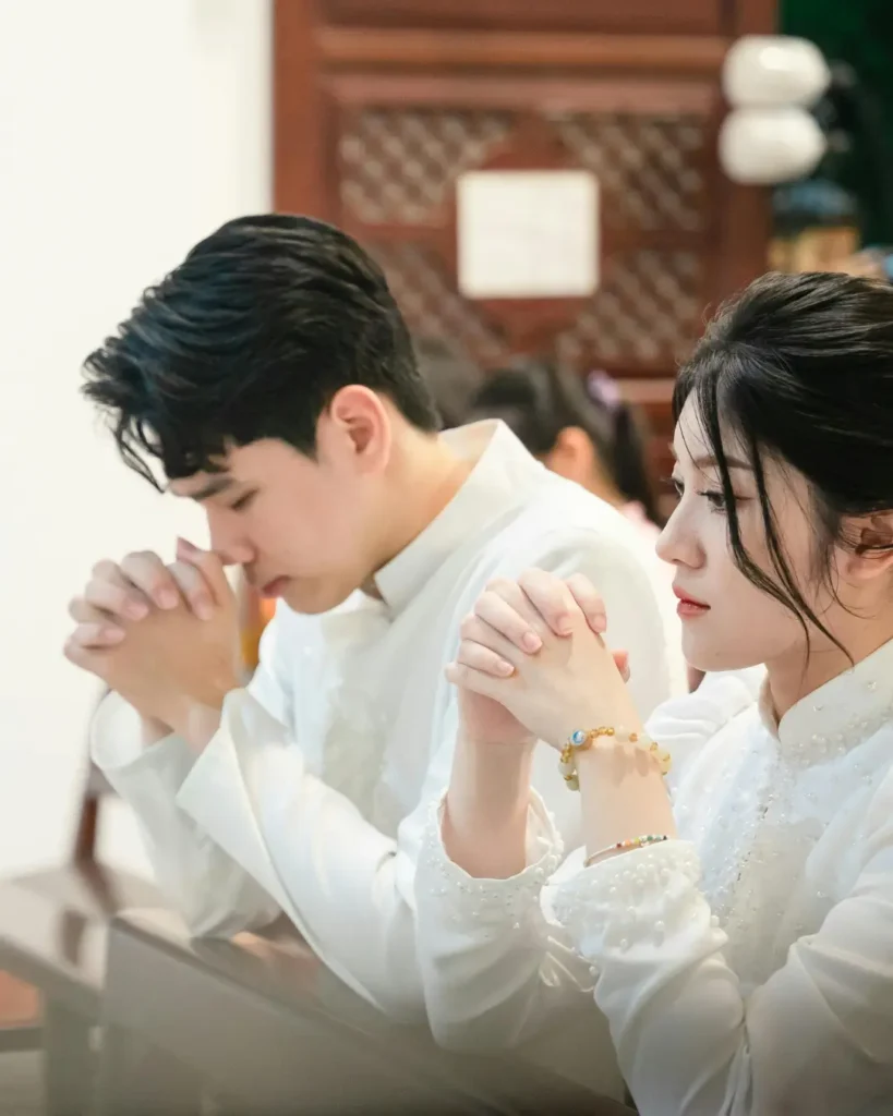 Young Couple Praying in a Peaceful Church Setting