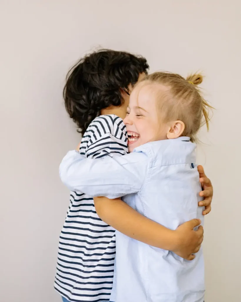 A Boy and Blonde Girl Hugging Each Other