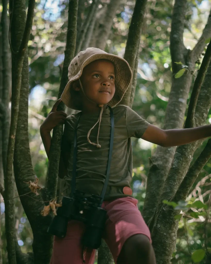 Kid Climbing Trees in the Forest