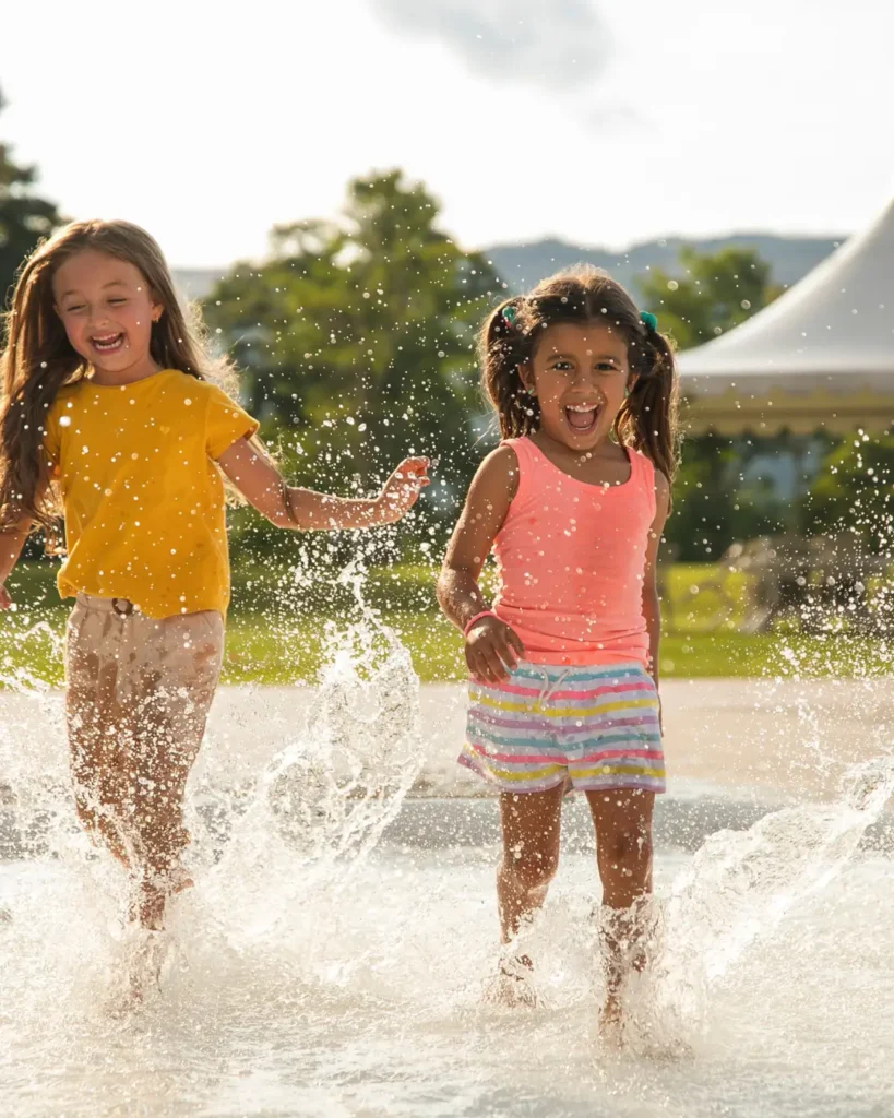 Kids Playing in the Water Outdoors