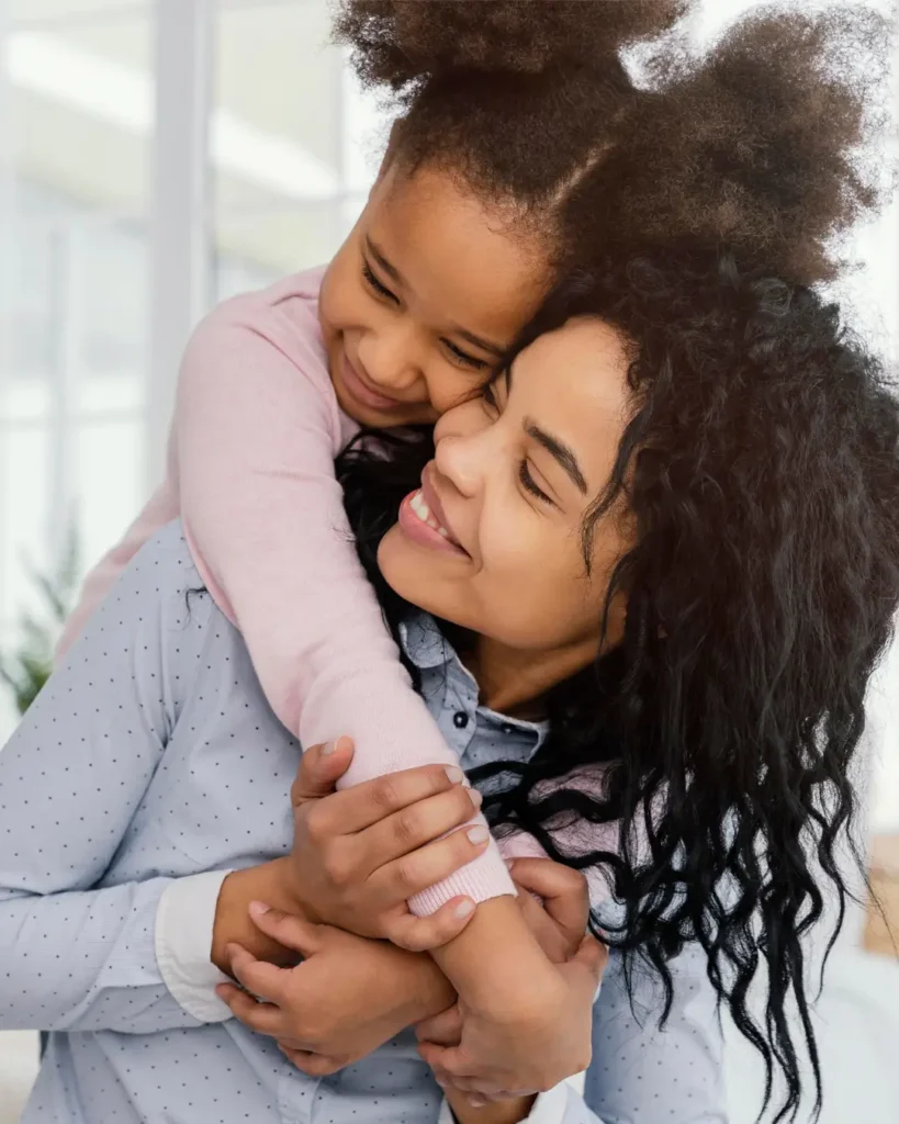 Mother Hugging Daughter From Behind