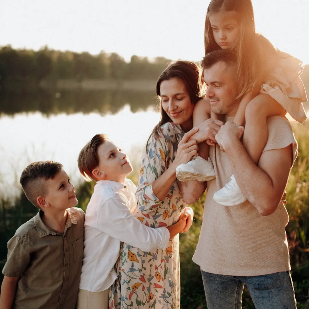 Smiling Family Sitting Together