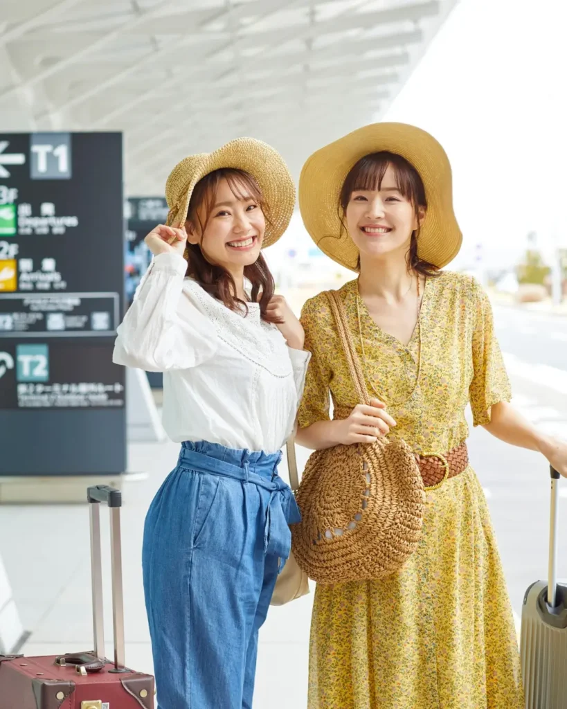 Women Traveling at the Airport with Luggage