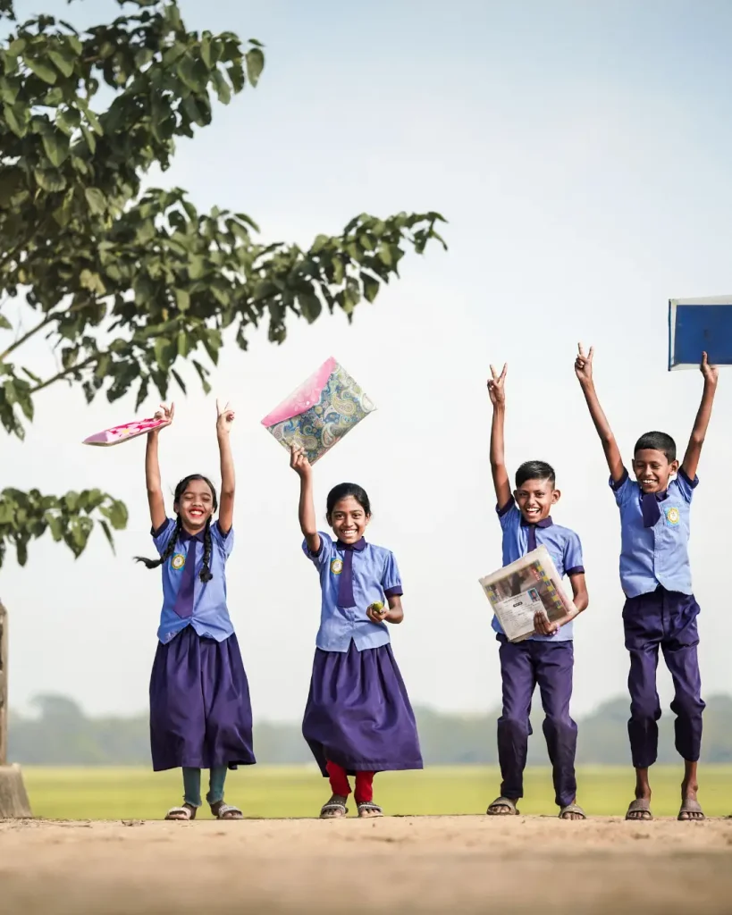 Joyful School Children Celebrating Outdoors