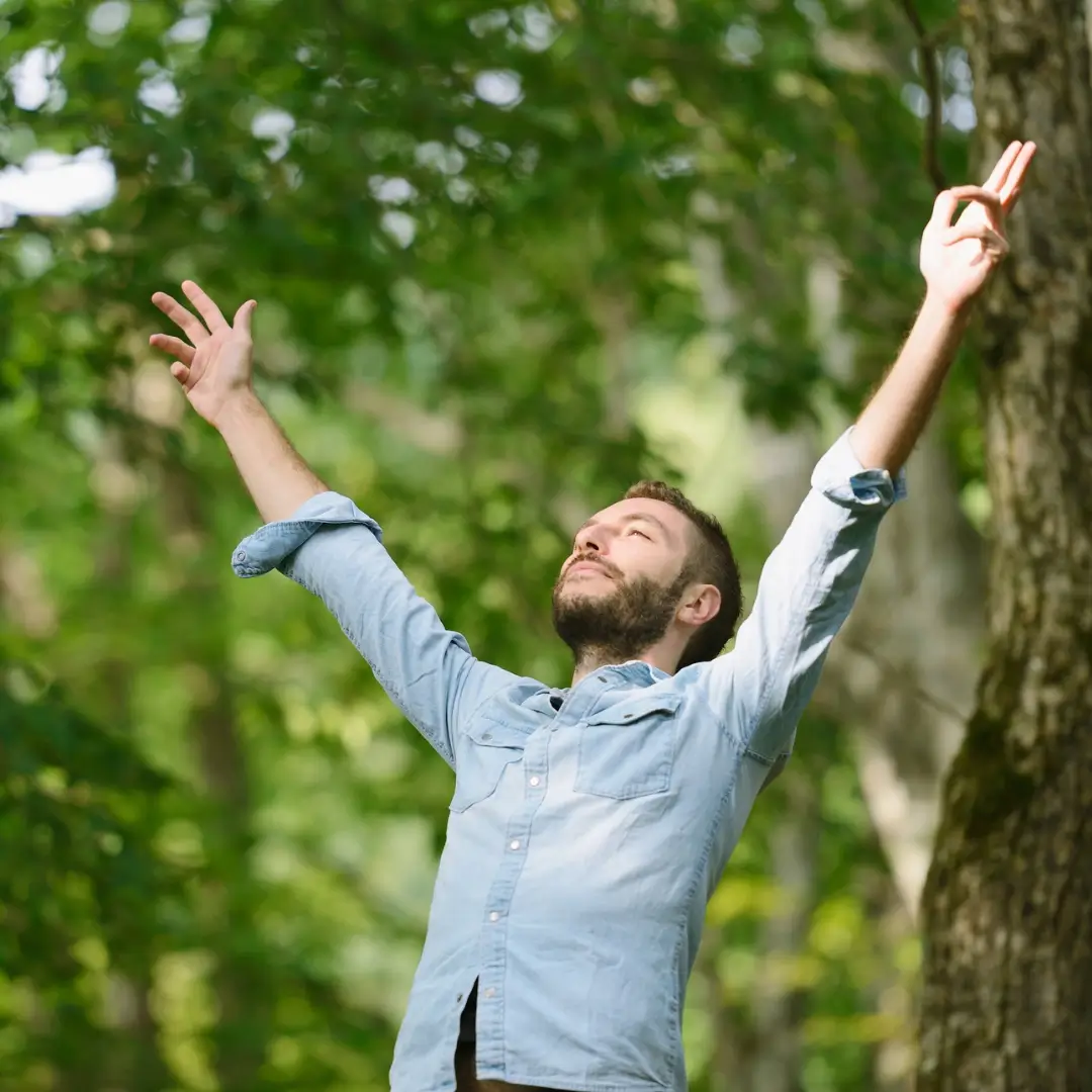 Man Embracing Nature with Outstretched Arms