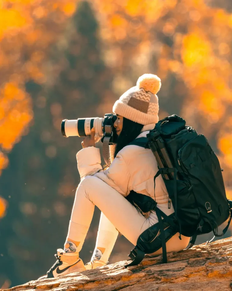 Photographer Capturing Autumn Nature Scene