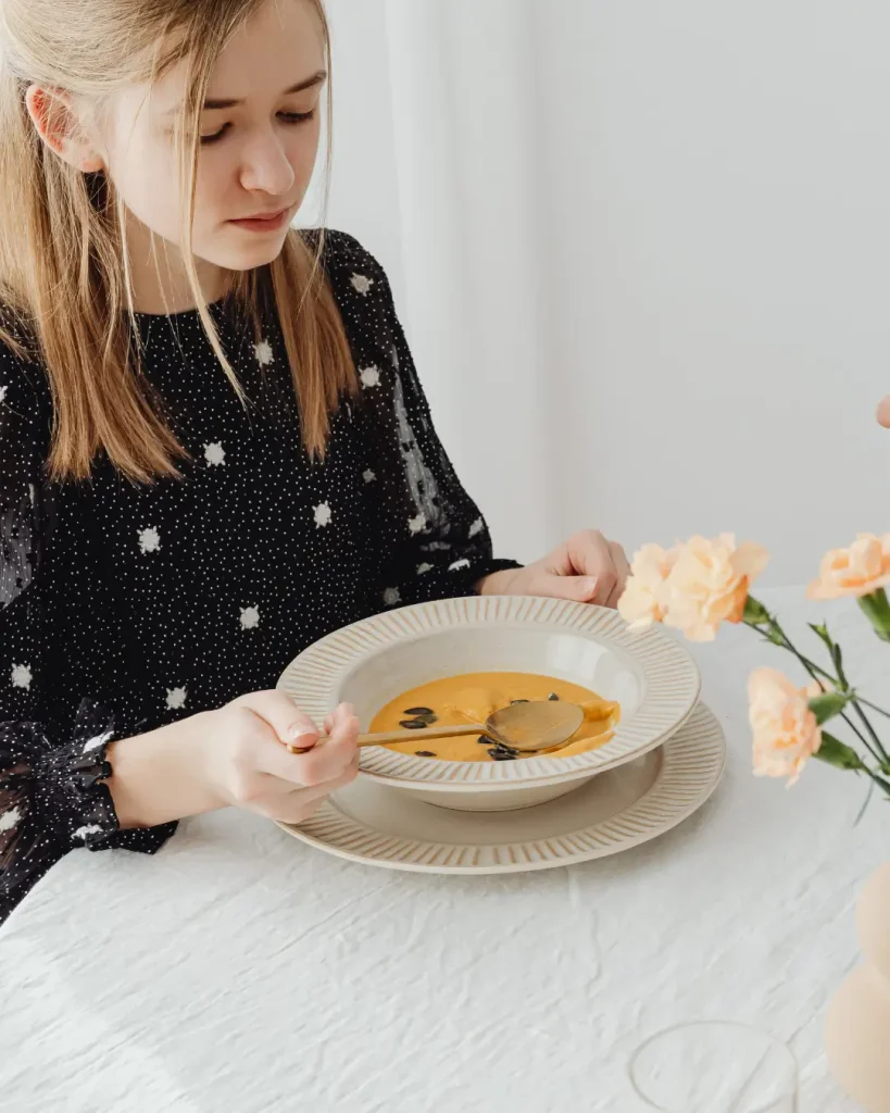 Women Eating Pumpkin Soup